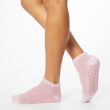 Person wearing pink two-toned tonal fuzzy Dr. Scholl's soothing spa socks. thumbnail