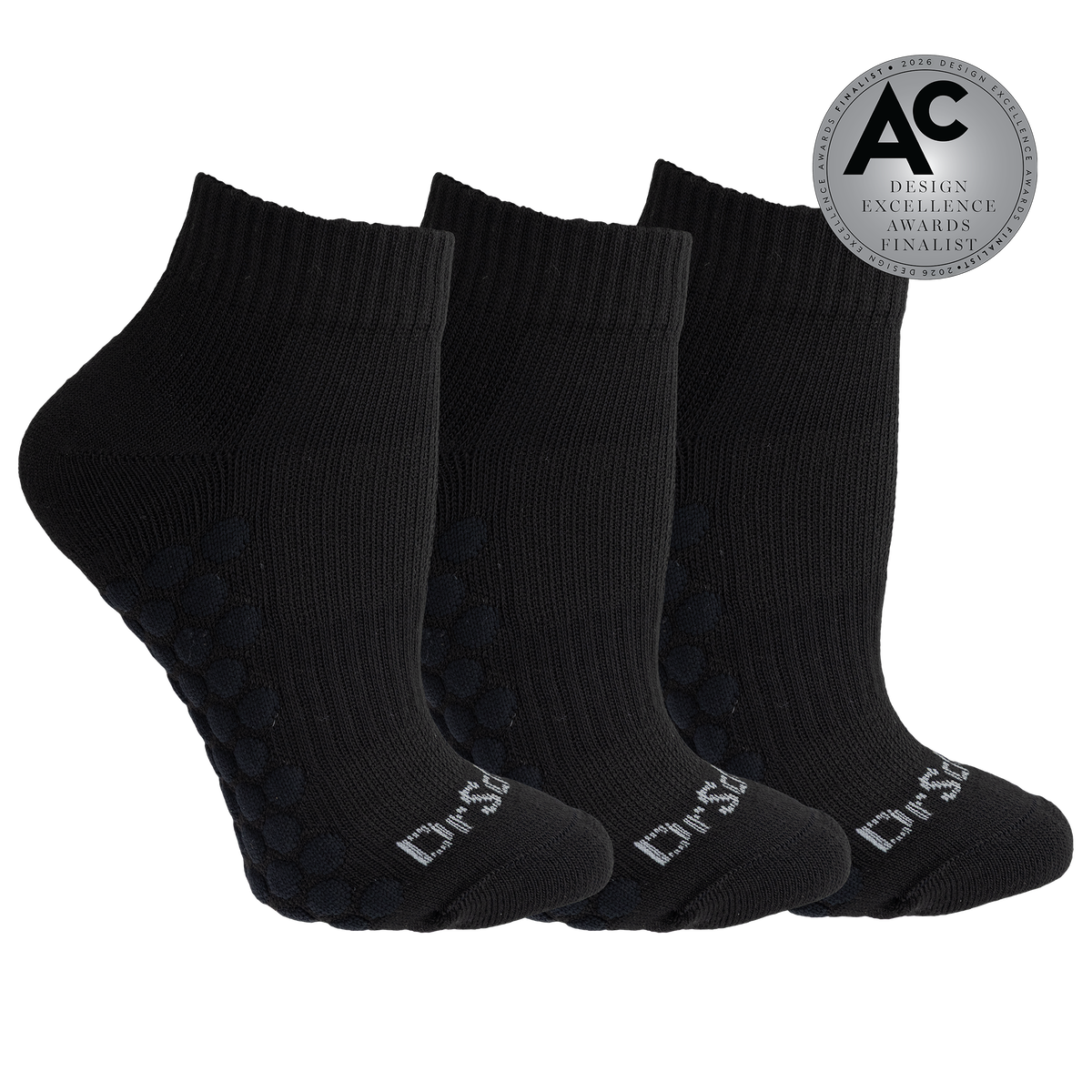 Three black ankle socks arranged in a fan shape on a white background, with textured grip dots on the soles and white 'Dr.SS' branding on the toes.