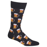 A single black crew sock with a repeating pattern of orange beer mugs filled with amber beer and white foam, shown on a plain white background.