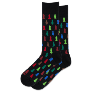 A pair of black crew socks with a repeating pattern of colorful Christmas tree silhouettes in red, green, blue, and brown, displayed against a solid white background.