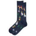 A pair of navy blue crew socks featuring a festive Christmas pattern with wirehaired dogs wearing red scarves and green hats, decorated with white snowflakes and green pine trees.
