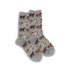 A pair of HOTSOX women's crew socks with a pattern of horses on a gray background.