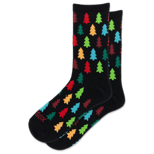A pair of black crew socks with a colorful pattern of Christmas tree silhouettes in red, green, blue, orange, and yellow, displayed on a clean white background.