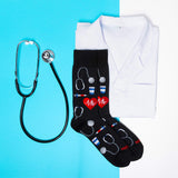 Black socks with medical-themed designs, a white lab coat, and stethoscope on a blue background thumbnail
