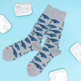 Gray socks with blue fish pattern on a light blue background