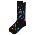 A pair of black crew socks with a colorful space-themed print featuring rockets, planets, stars, and the text 'I NEED SPACE'.