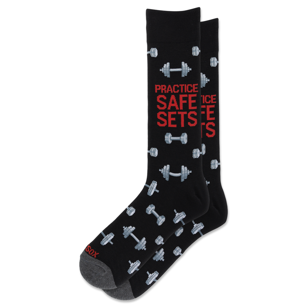 A pair of black crew socks with a gray and red graphic design featuring dumbbells and the text 'PRACTICE SAFE SETS' in red and gray.