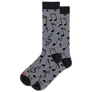 A pair of crew socks with a gray heather body patterned with black musical notes and clefs, featuring solid black heels, toes, and cuffs. A small red logo is visible on the toe.