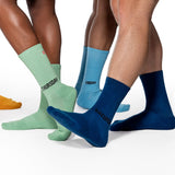 Three pairs of socks labeled 'Thursday', 'Friday', and 'Saturday' worn by different people on a white background. thumbnail