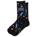 A pair of black crew socks with a colorful space-themed pattern featuring blue rockets, pink and yellow planets, and the text 'I NEED SPACE' on a white background.