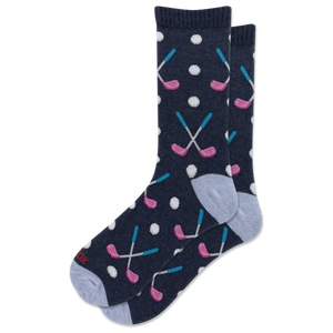 A pair of navy blue crew socks with a golf-themed pattern featuring pink and blue golf clubs, white golf balls, and light blue heels and toes.