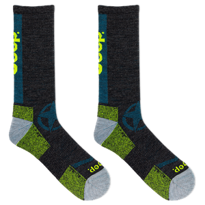 Pair of black socks with green and gray accents on a white background
