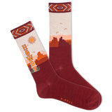 A pair of men's crew socks with a Southwestern desert landscape design, featuring the text 'HOWDY' and a sun motif, in a red color. thumbnail