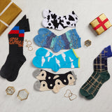 Collection of colorful socks with various patterns on a light gray surface.