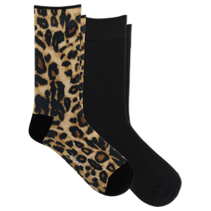 Two crew socks shown on a white background: one with a tan, brown, and black leopard print and one solid black.