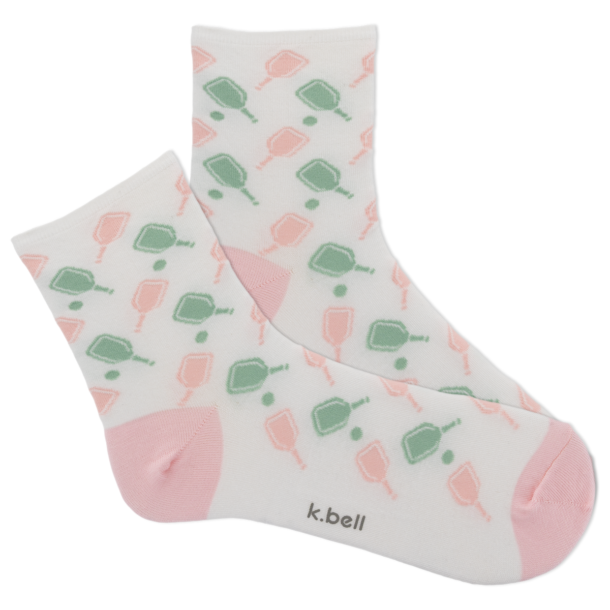 Pair of socks with a pattern of green and pink shapes on a white background, featuring the brand 'k.bell'.
