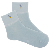 Light blue socks with embroidered designs on a white background