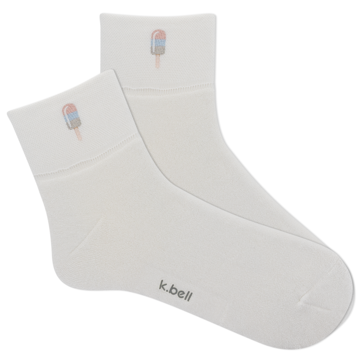 White socks with ice cream cone design and 'k.bell' branding on a white background