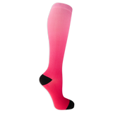 Dr. Scholl's women's compression socks featuring a light to hot pink dip dye color and black accents at the heel and toe.