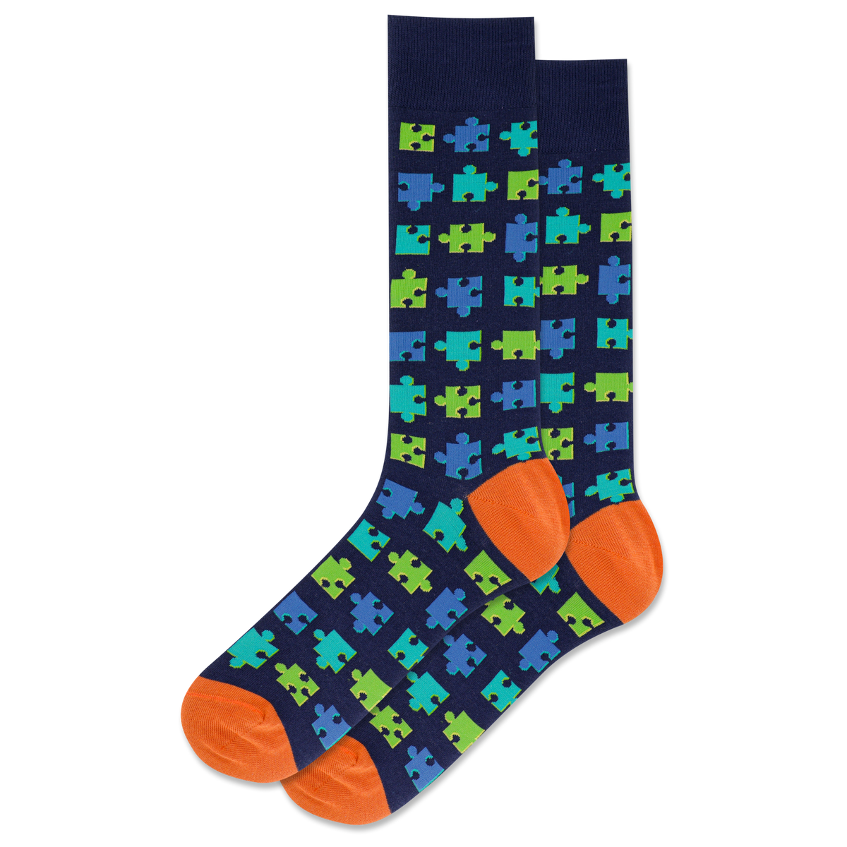 Navy sock with green and blue puzzle piece pattern and orange toes and heels on a white background