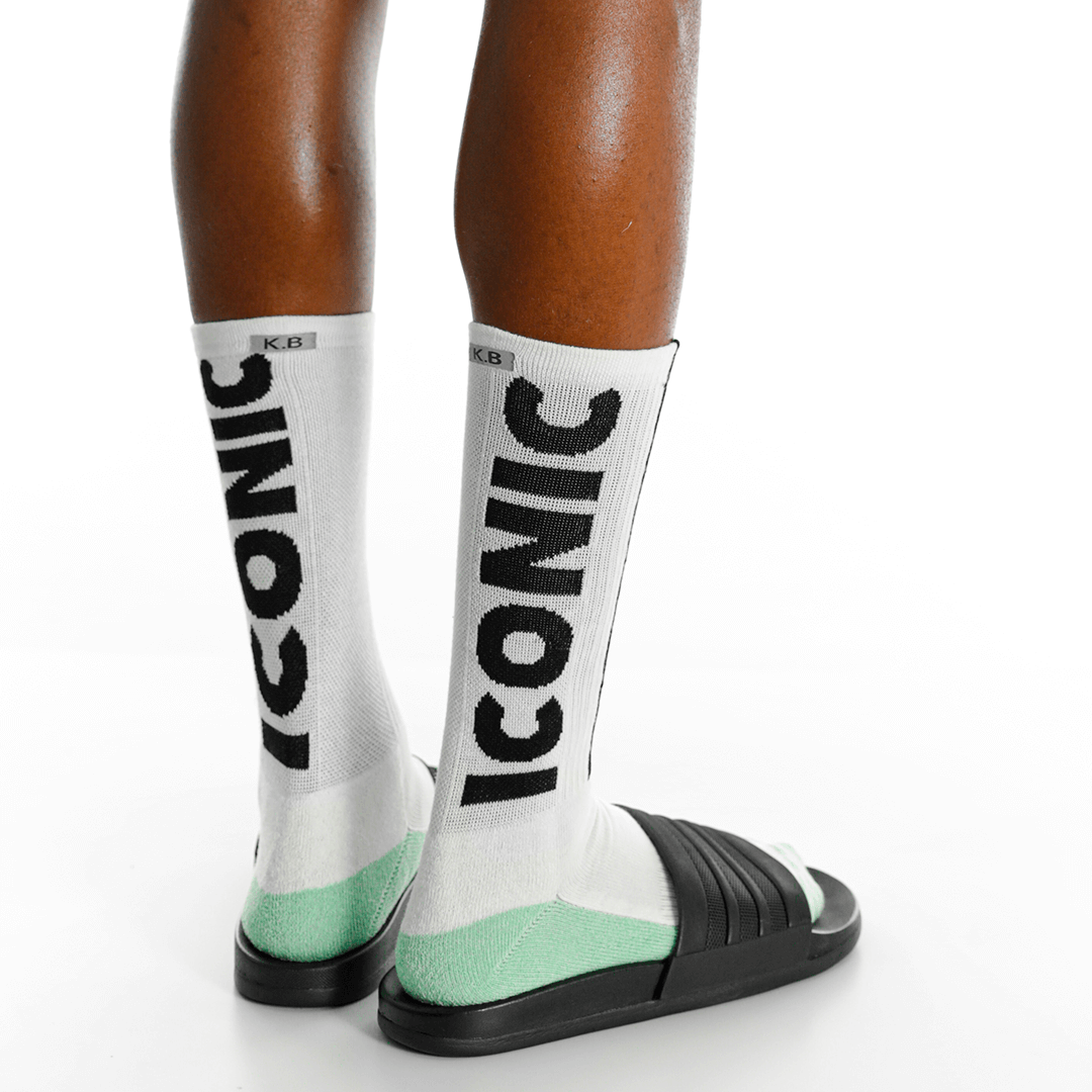 White socks with 'Icon' branding worn by a person on a white background