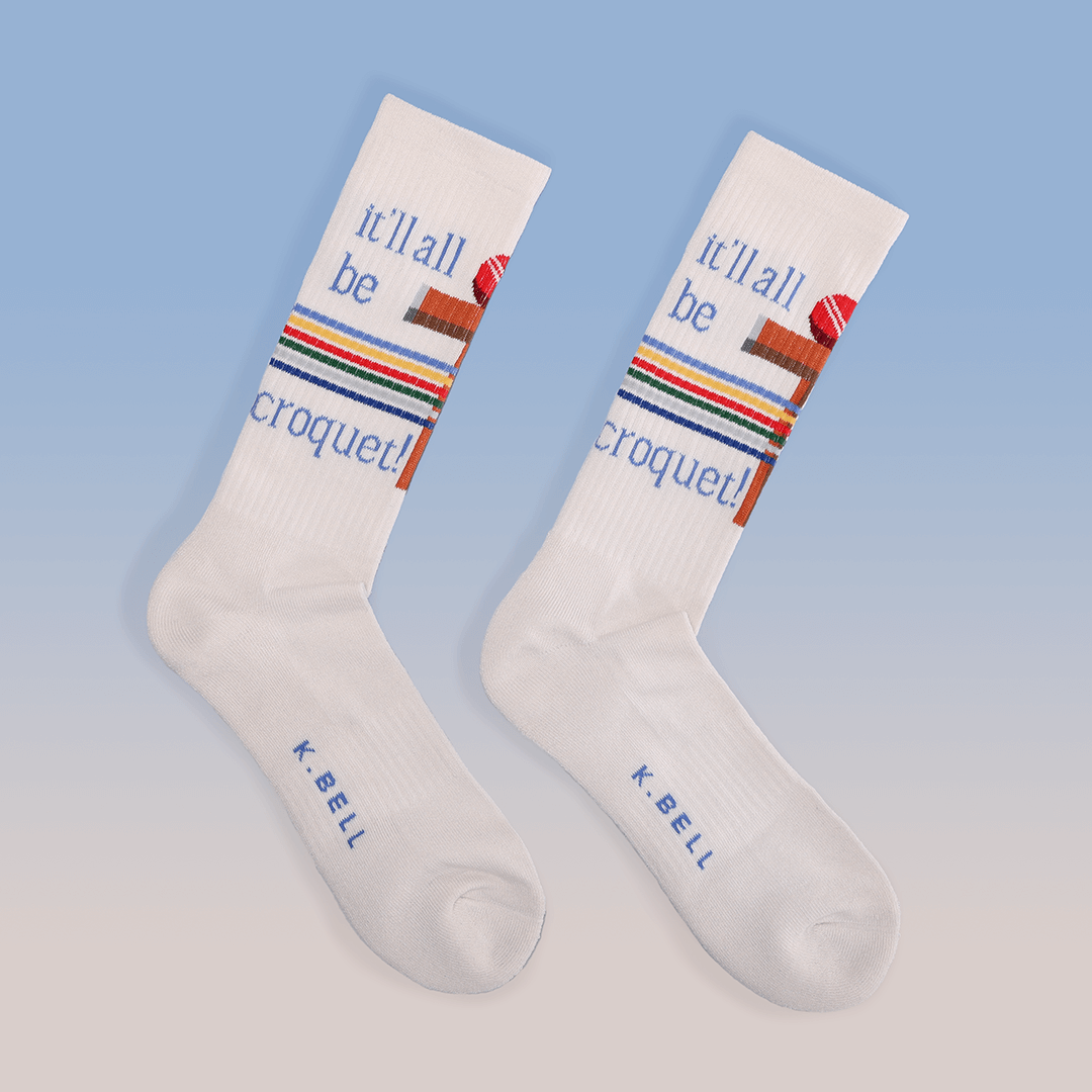White socks with colorful text and design on a light blue background
