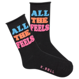 A pair of black fuzzy socks with the text 'All The Feels' in blue and pink colors, and the brand name 'K.Bell' at the end of the foot. thumbnail