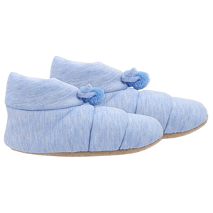 Pair of blue slippers with pom pom details on a white background