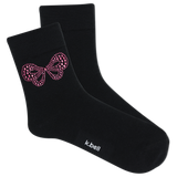 Black socks with pink bow design and 'k.bell' branding on a white background