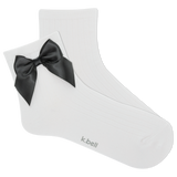 White sock with a black bow on a white background, featuring the brand 'k.bell'.