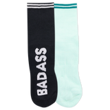 Two ankle socks, one black and one white, with the word 'BADASS' written across the cuffs and a reflective logo on the black sock.