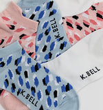 Colorful patterned socks with 'K. Bell' branding on a white background thumbnail