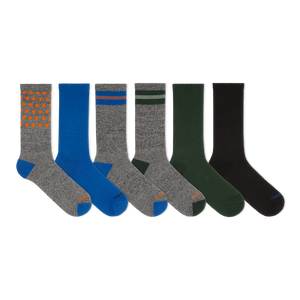 Set of six pairs of socks in various colors on a white background