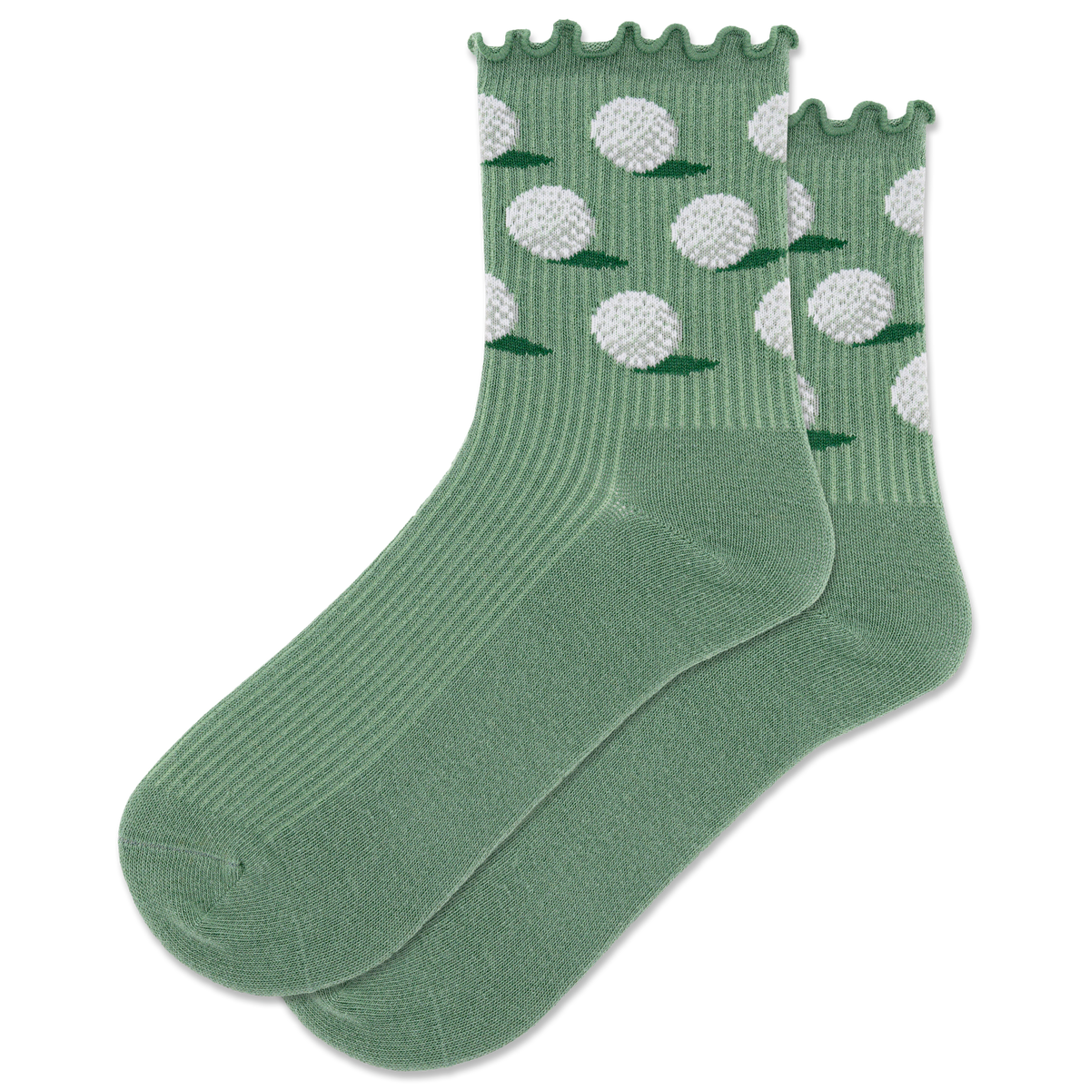 A pair of green crew socks with a lettuce edge design and white golf ball patterns, displayed on a piece of grass next to a golf club and two golf balls.